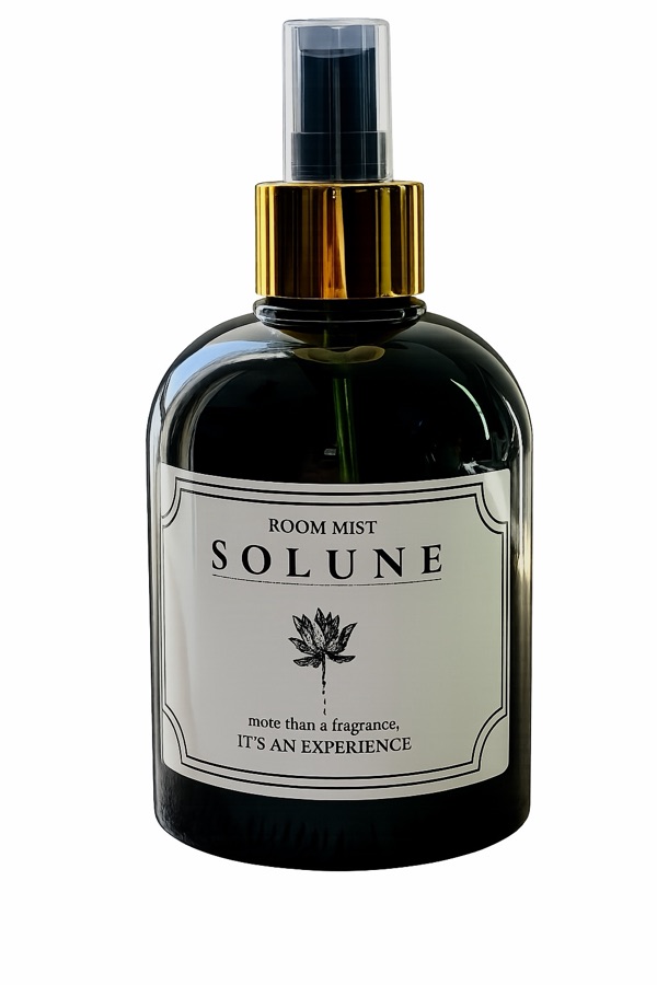 Solune room mist in a dark glass bottle with a gold spray collar and cream label